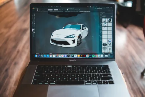 Ilustrasi laptop yang membuka software desain gratis untuk membuat grafis media sosial